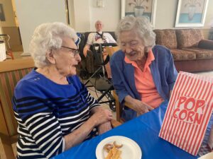 Two women smiling and talking